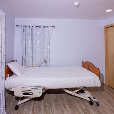 A private resident room with an adjustable bed