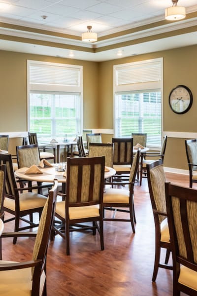 Bright dining room with tables and chairs