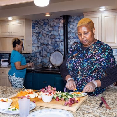 Staff preparing healthy snacks in the kitchen