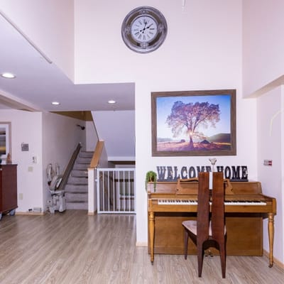 Interior view of a welcoming lobby area with a piano