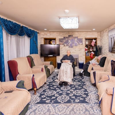 Residents relaxing in a cozy indoor lounge area