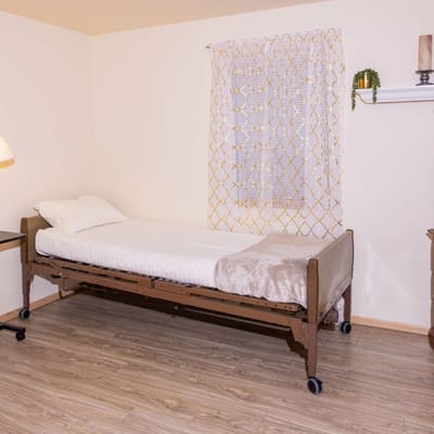 A simple private room with a hospital bed