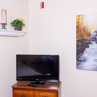 Interior room with a TV and wall art