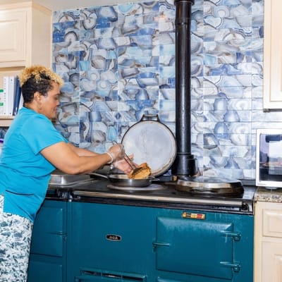 Staff member preparing food in the kitchen