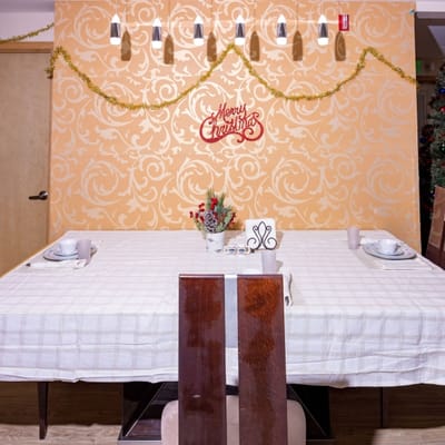 Festively decorated dining area with a table set for Christmas