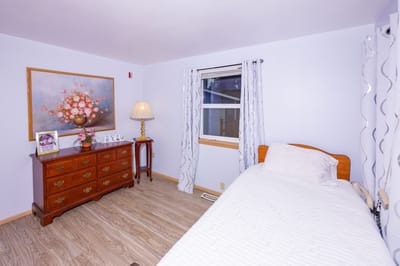 Cozy resident room with a single bed and decor