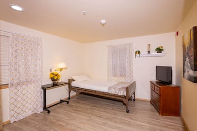 Private resident room with a bed and furniture