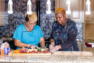 Staff preparing a meal together in the kitchen