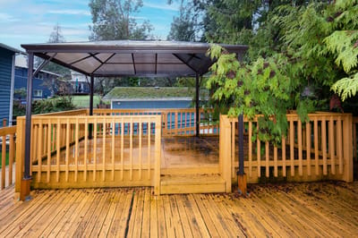 Covered outdoor seating area with wooden deck