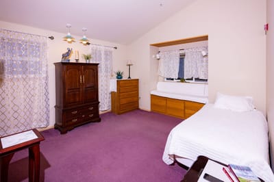 Cozy resident room with a bed and furniture