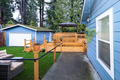 Outdoor patio area with deck and furniture