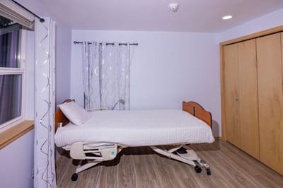 Private resident room with an adjustable bed