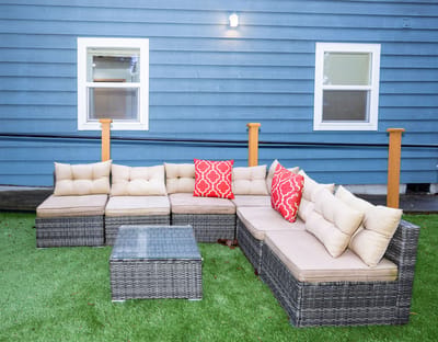 Outdoor seating area with sofas and cushions
