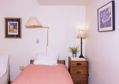 Cozy resident room with bed and decor