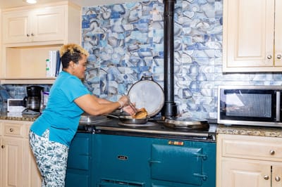 Staff member preparing food in a kitchen