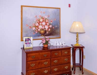 Decorative interior with flowers and a lamp