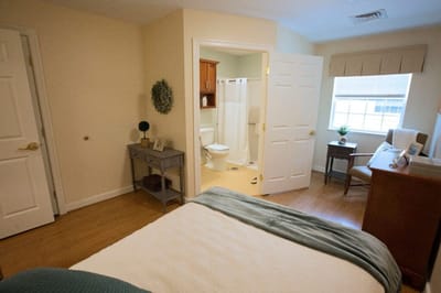 Cozy resident room with a bed and sitting area