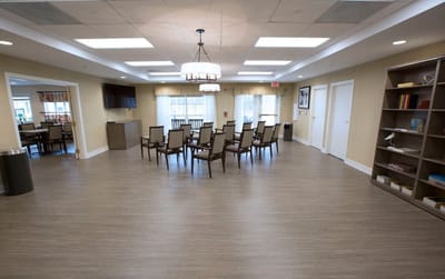 Bright common area with seating and bookshelf