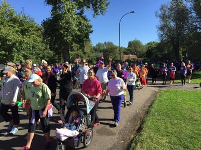 Community event with participants walking outdoors