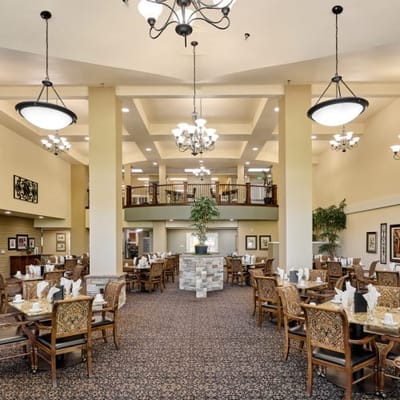 Elegant dining room with tables set for meals