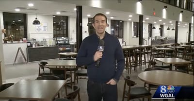 TV host speaking in a dining area of a facility