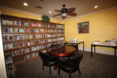 Cozy library area with bookshelves and seating