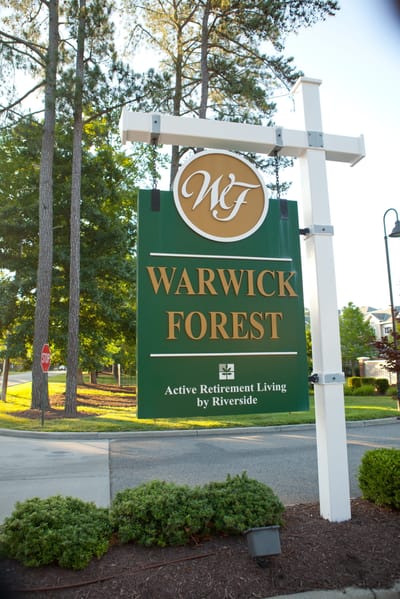 Facility sign displaying Warwick Forest logo