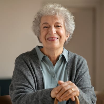 Smiling older woman in a common area