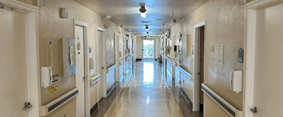 Long corridor with resident rooms and doors