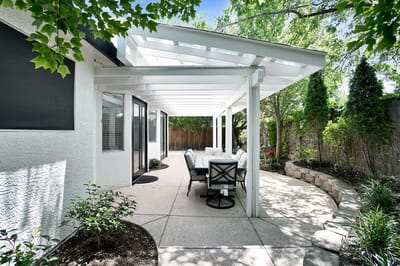 Outdoor patio area with seating under a pergola