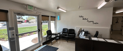 Reception area with chairs and desk