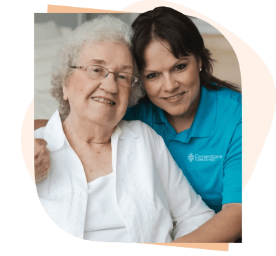 Staff member with resident in a cozy interior