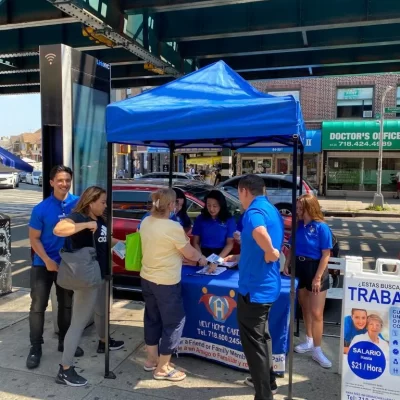 Staff and community members at an outdoor event