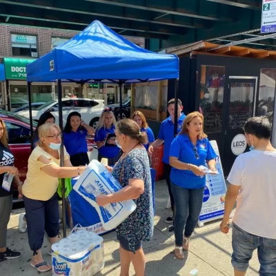 Community event with staff and residents interacting.