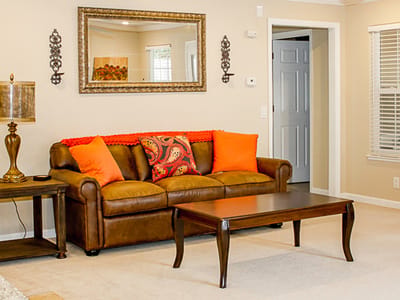Comfortable living room with seating and decor.