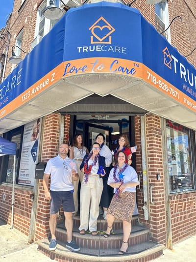 Staff celebrating outside the True Care Home Care facility.