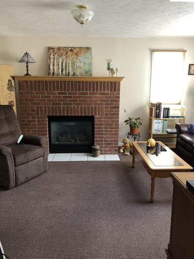Cozy interior space with a fireplace and seating