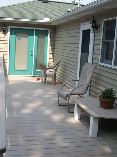 Outdoor patio seating area with plants.