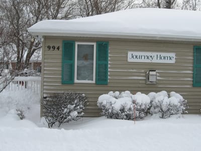 Exterior view of Journey Home with snow
