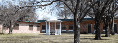 Outdoor area with gazebo and trees at the facility