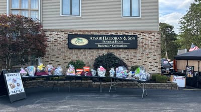 Outdoor event setup in front of a funeral home