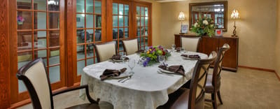 Elegant dining room setup with floral centerpiece