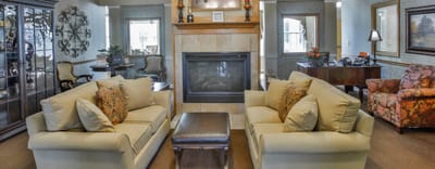 Common area with sofas and a fireplace