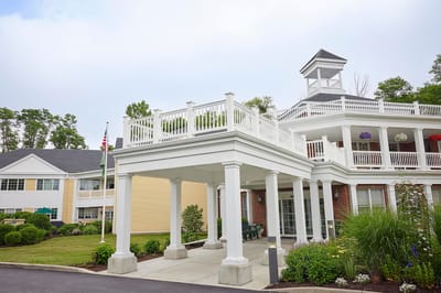 Brandywine The Savoy, assisted living in Queens, NY — Senior living facility entrance with garden landscaping