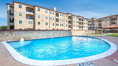 Swimming pool area surrounded by residential buildings