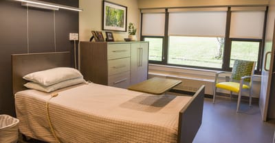 Private resident room with bed and furnishings