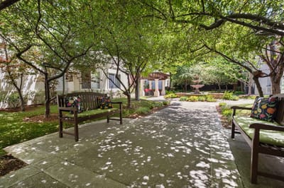 Serene outdoor garden area with seating and fountain