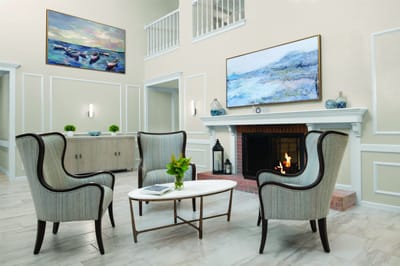 Cozy common area with chairs and fireplace