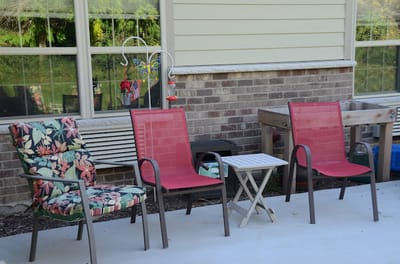 Outdoor seating area with chairs and table