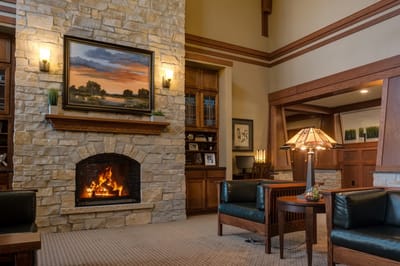 Cozy interior lounge with a fireplace and artwork